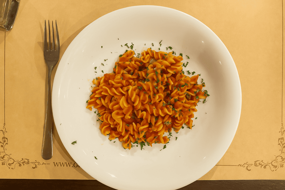 Penne Arrabbiata is a fiery Italian pasta dish made with penne noodles in a zesty tomato and chili garlic sauce